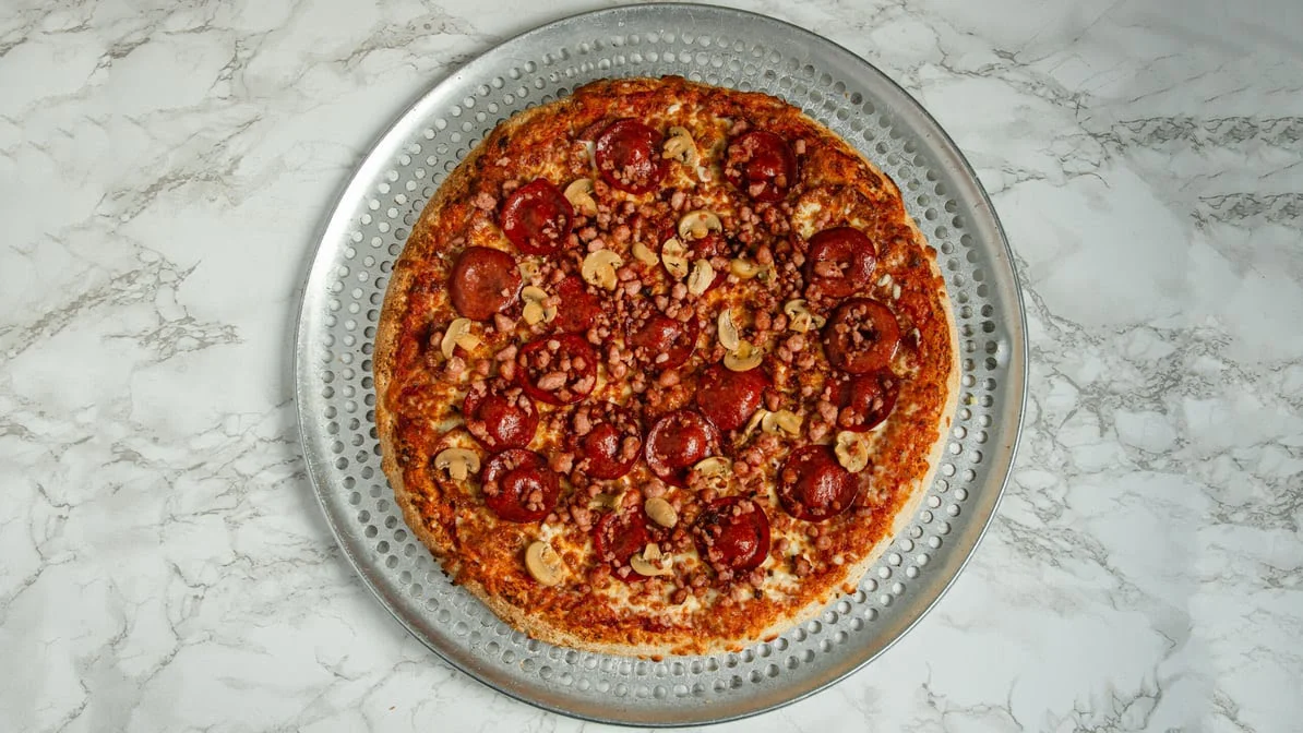 Canadian Pizza with pepperoni, bacon and mushrooms at Jambo Pizza, Winnipeg
